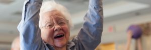 Elderly Woman Partaking in Fitness at Assisted Living