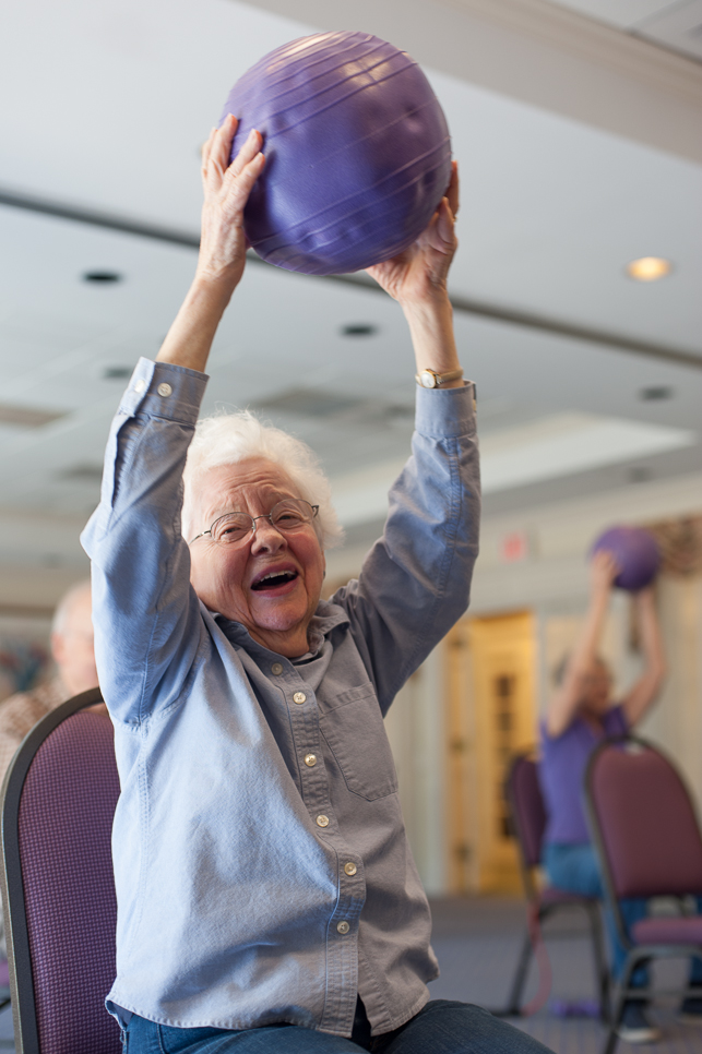 Elderly Woman Partaking in Fitness at Assisted Living
